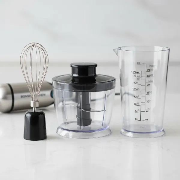 Close-up of Bonsenkitchen hand mixer attachments: egg whisk, chopper bowl, and beaker.