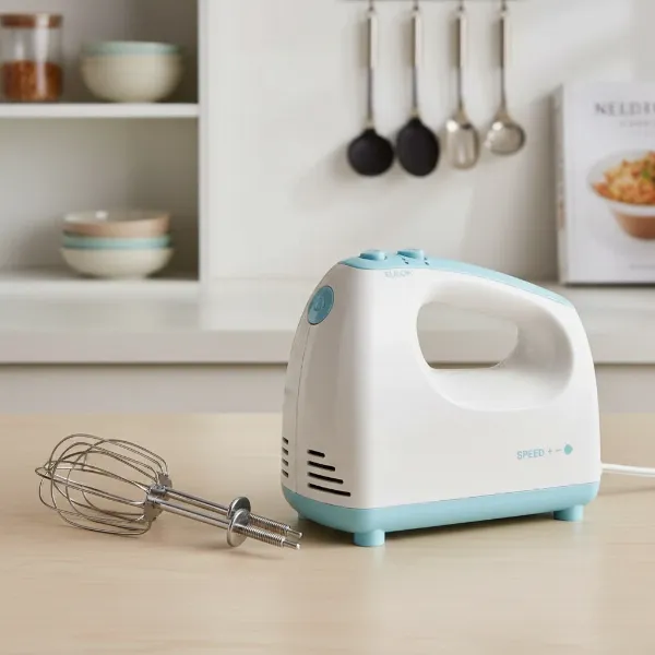 An ergonomic hand mixer with beaters and whisks, emphasizing comfortable grip and storage.