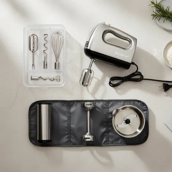 Various hand mixer attachments, including beaters, dough hooks, and a whisk, neatly stored.