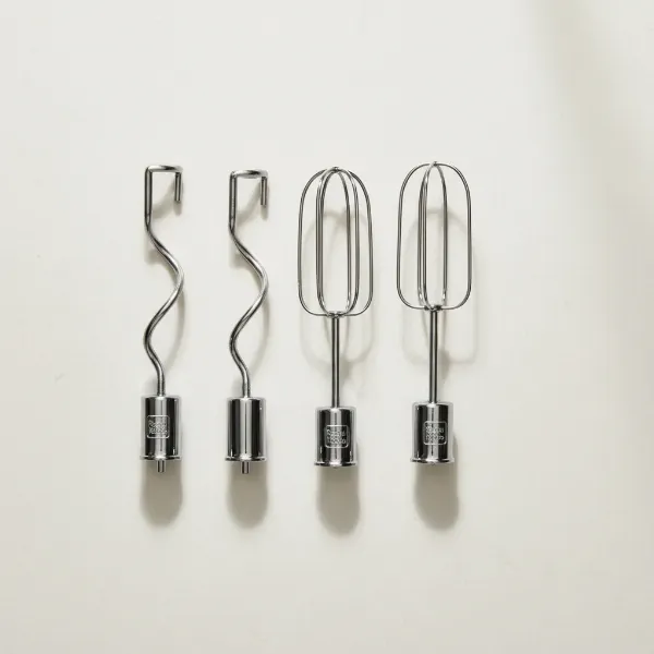 Chrome-plated beaters and dough hooks for the Russell Hobbs Retro Hand Mixer, neatly arranged.
